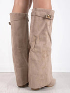 Knee high boots with a stylish flared top and comfortable block heel, perfect for fashionable fall and winter outfits. 8