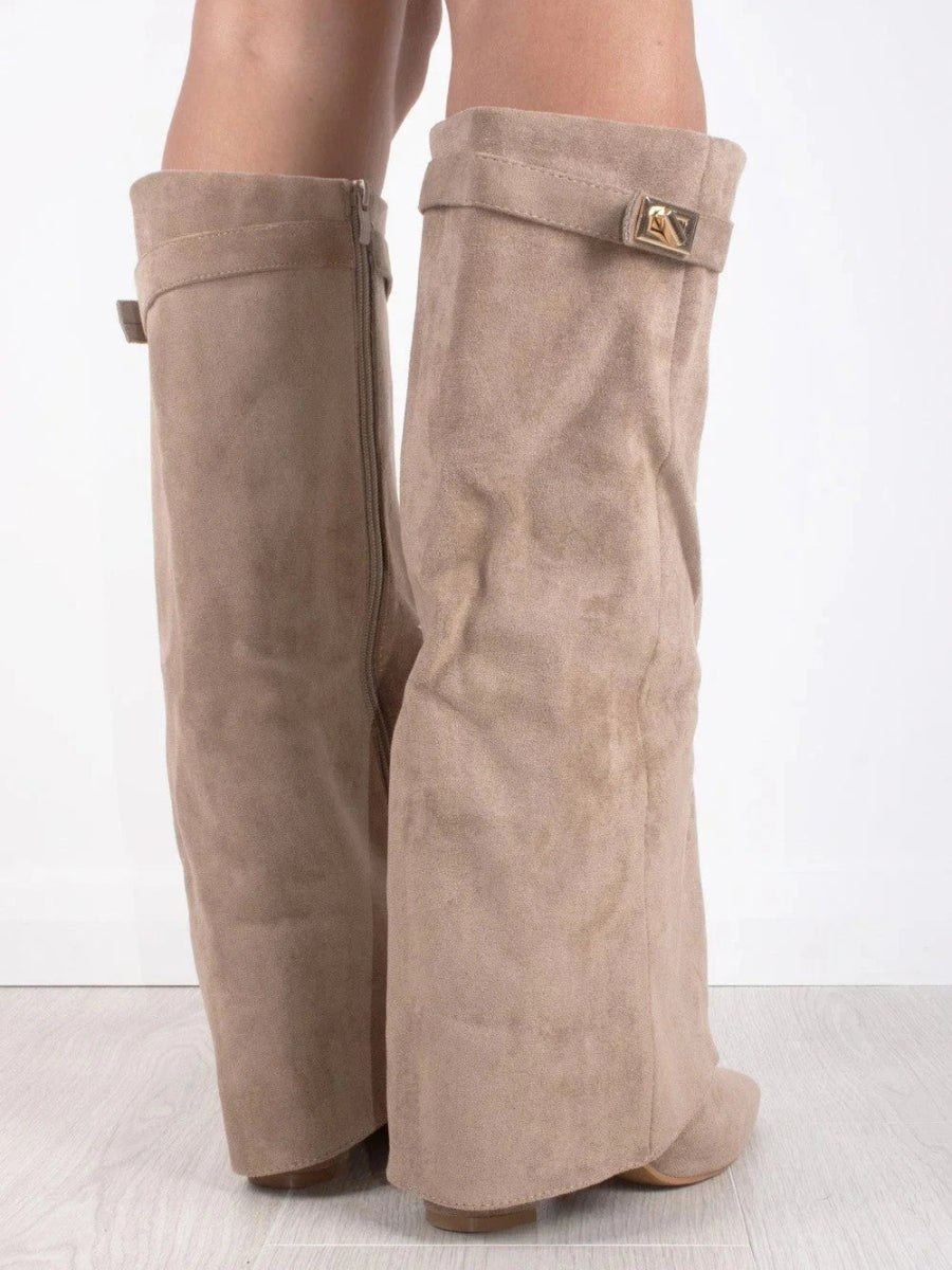 Knee high boots with a stylish flared top and comfortable block heel, perfect for fashionable fall and winter outfits. 8