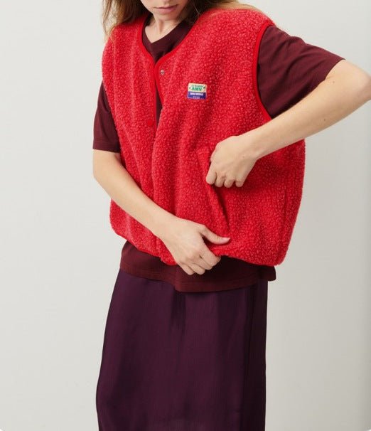 Lambswool vest with button front in slim fit, showcasing a stylish design and cozy texture, perfect for layering in cooler weather. 10