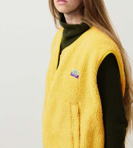Lambswool vest with button front in slim fit, showcasing a stylish design and cozy texture, perfect for layering in cooler weather. 8