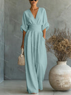 V-Neck jumpsuit for women featuring a tailored fit and luxurious silk-touch fabric, perfect for elegant occasions and stylish outings. 10