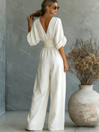 V-Neck jumpsuit for women featuring a tailored fit and luxurious silk-touch fabric, perfect for elegant occasions and stylish outings. 4