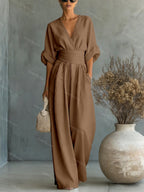 V-Neck jumpsuit for women featuring a tailored fit and luxurious silk-touch fabric, perfect for elegant occasions and stylish outings. 9