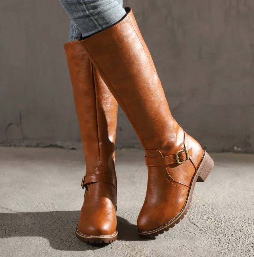Stylish women's boots featuring a removable footbed and shock-absorbing sole, designed for comfortable everyday wear. 0