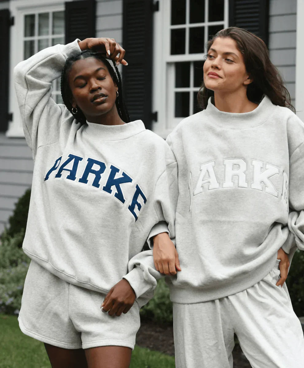 Women's oversized sweatshirt featuring soft chenille lettering, perfect for casual everyday wear and stylish comfort. 10