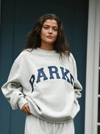 Women's oversized sweatshirt featuring soft chenille lettering, perfect for casual everyday wear and stylish comfort. 4