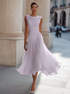 Women's sleeveless pleated midi dress in plus size, perfect for formal cocktails, featuring a flattering silhouette and elegant design. 10