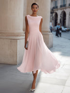Women's sleeveless pleated midi dress in plus size, perfect for formal cocktails, featuring a flattering silhouette and elegant design. 12