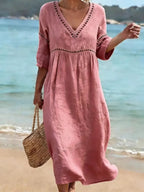 Women's summer V-neck cotton dress featuring a flowy casual style and convenient side pockets, perfect for warm weather outings. 5